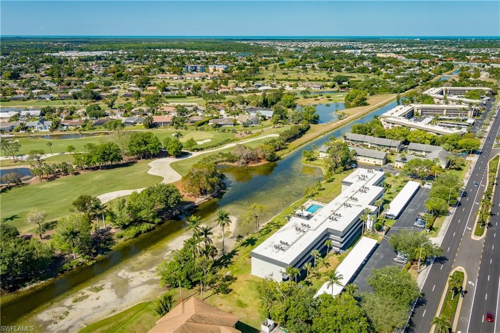 Bird's eye view featuring a water view and golf course view