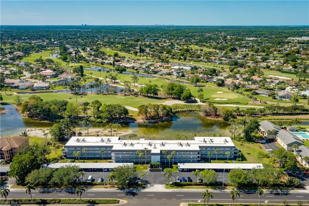 Aerial view with a water view and golf course view