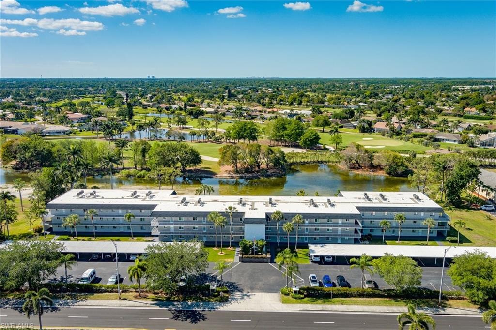 Bird's eye view featuring view of golf course and a water view