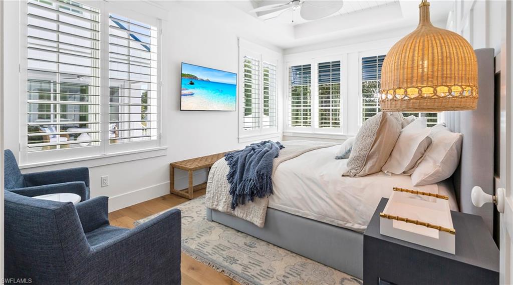 Bedroom with light wood-style floors and ceiling fan