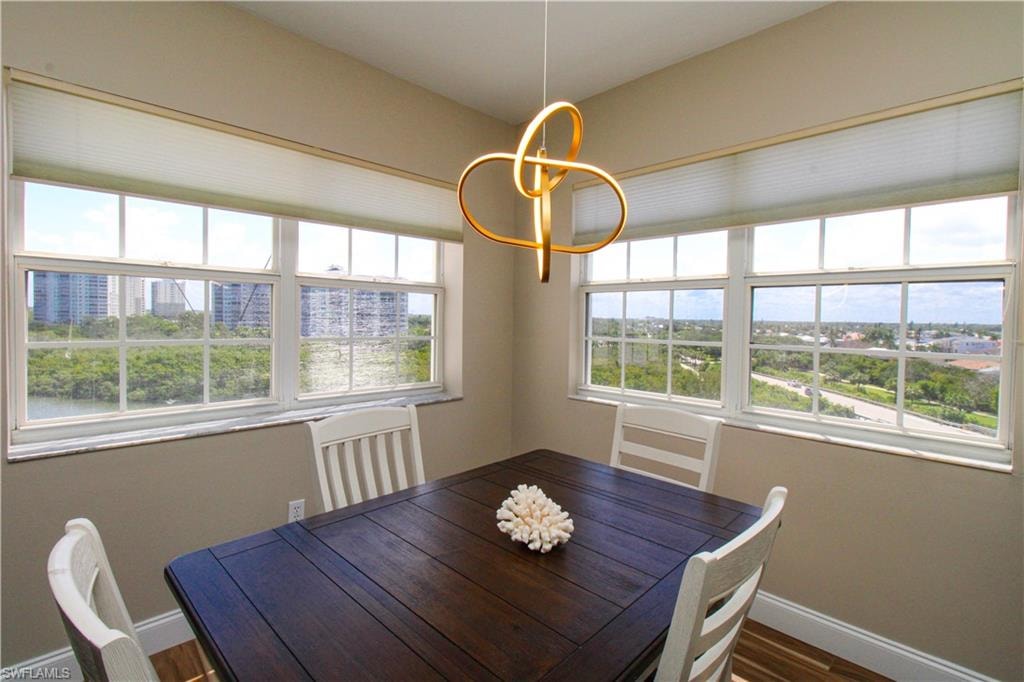 Unfurnished dining area featuring wood-type flooring
