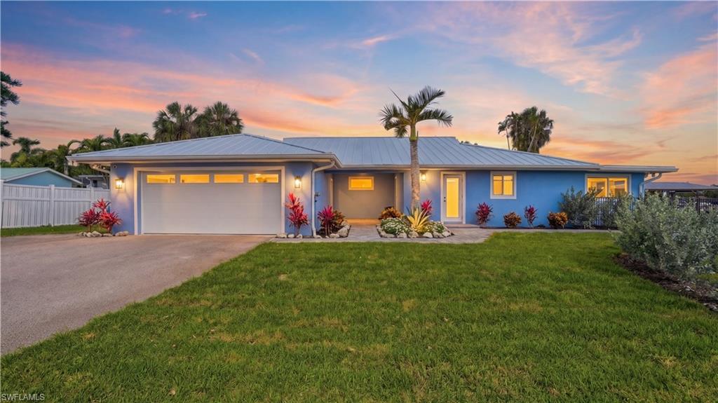 Front of home with evening lighting