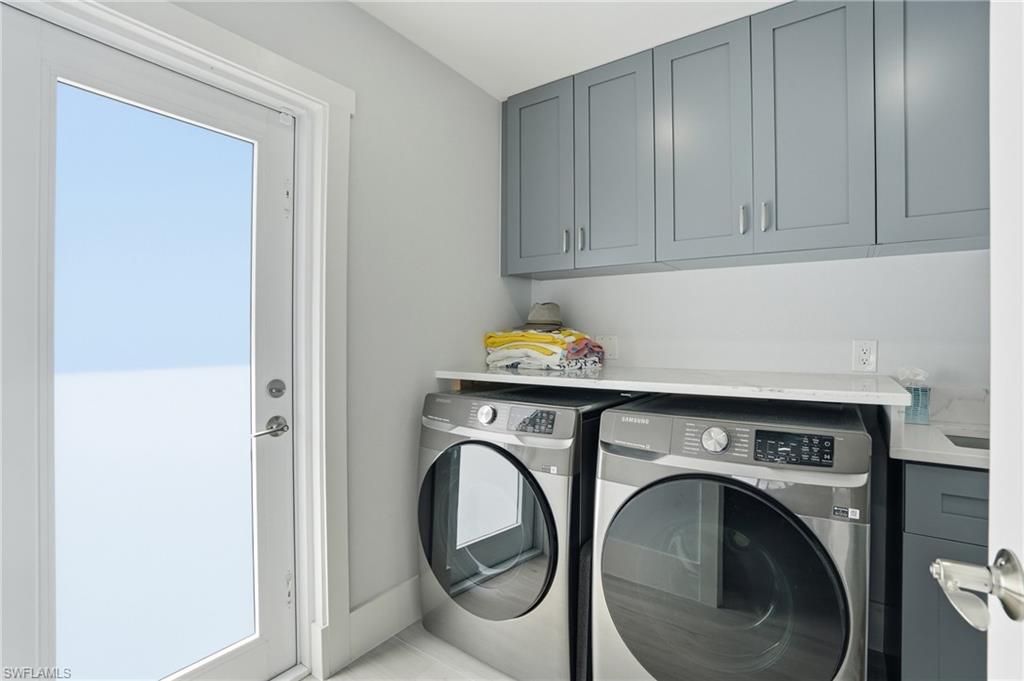 laundry room with exterior door