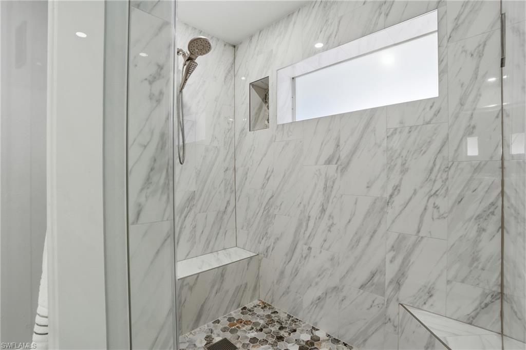 primary bath with window in shower