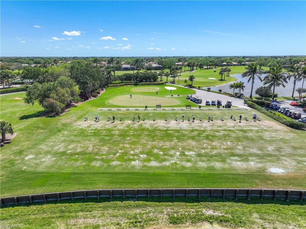 Drone / aerial view of a golf club and a nearby body of water