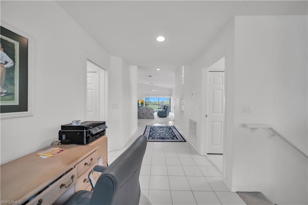 Home office featuring light tile patterned floors and recessed lighting