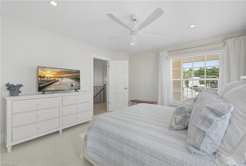 Bedroom featuring a ceiling fan and carpet flooring