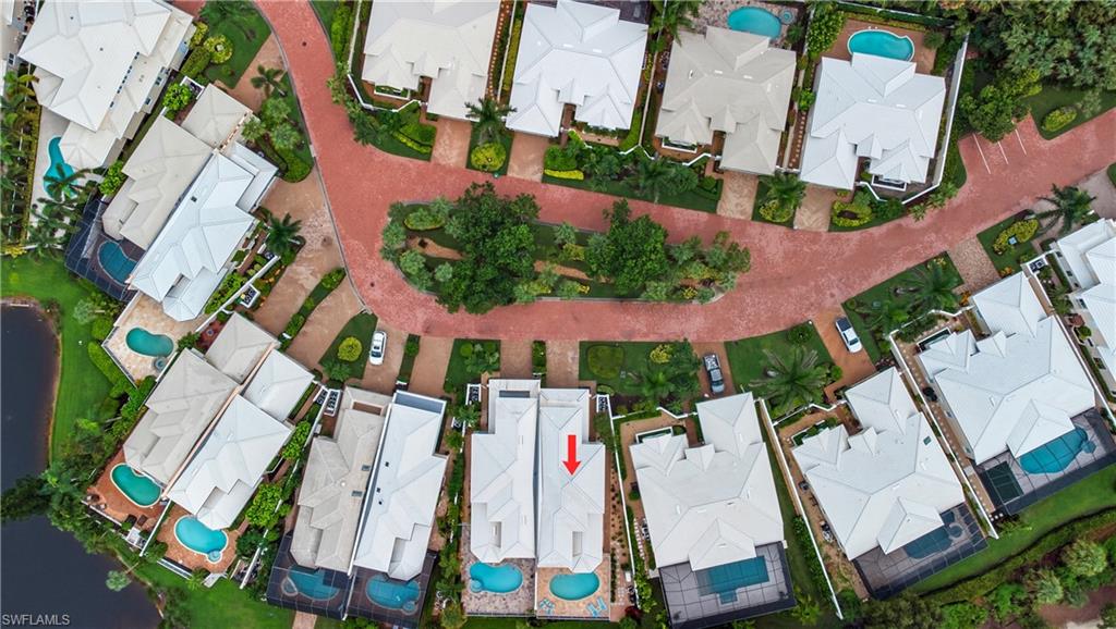 Aerial perspective of suburban area with a pool
