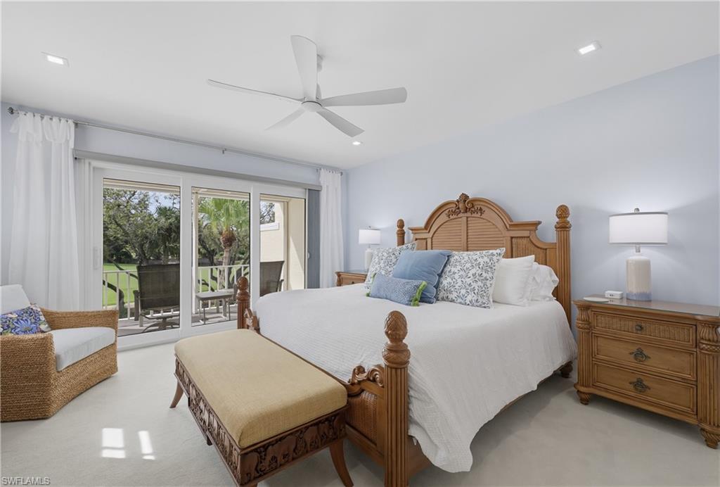 Carpeted bedroom featuring access to exterior, a ceiling fan, and recessed lighting