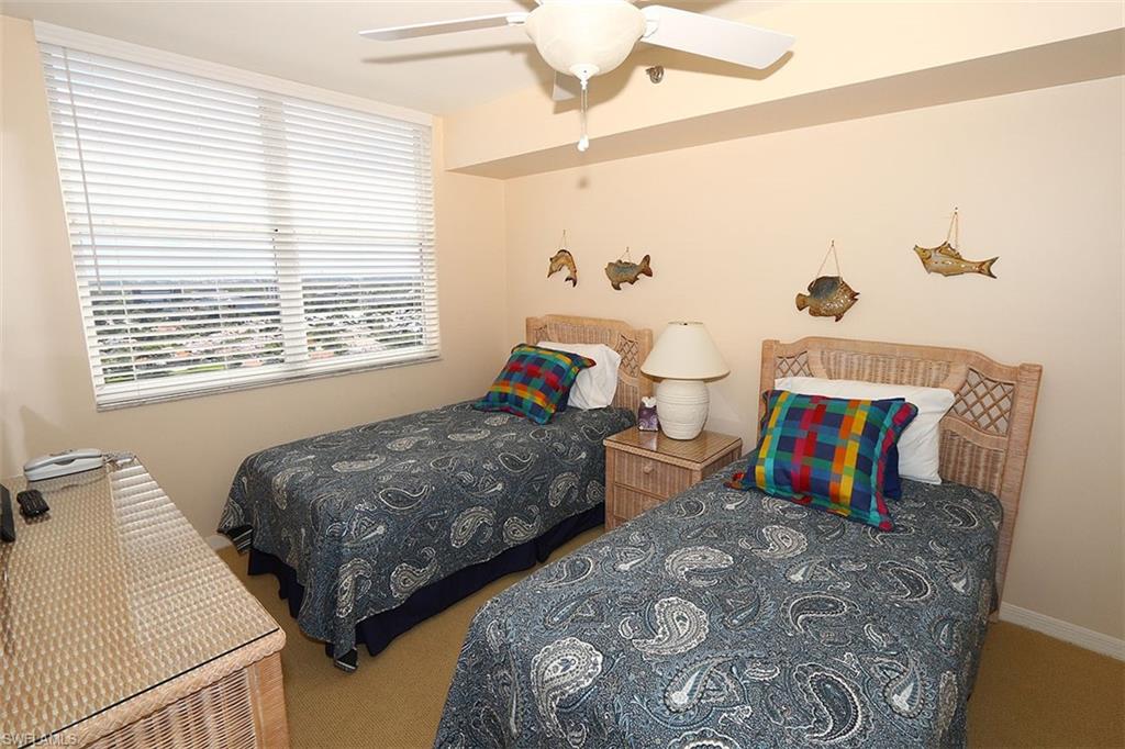 Carpeted bedroom with ceiling fan