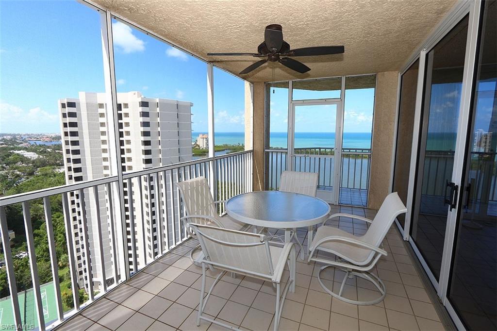 Balcony with ceiling fan and a water view