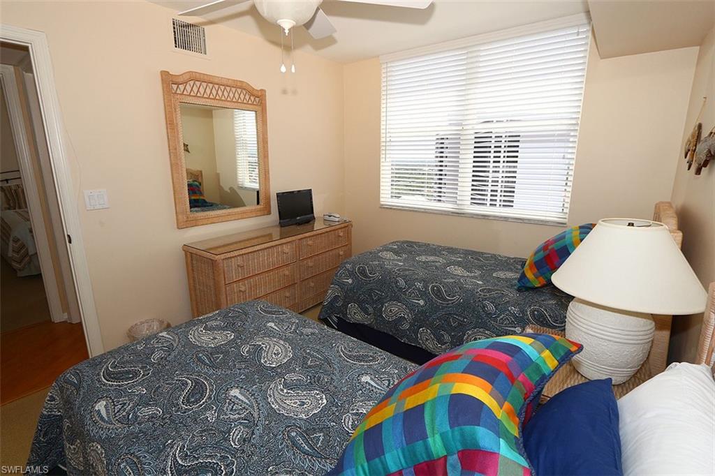 Bedroom featuring wood-type flooring and ceiling fan
