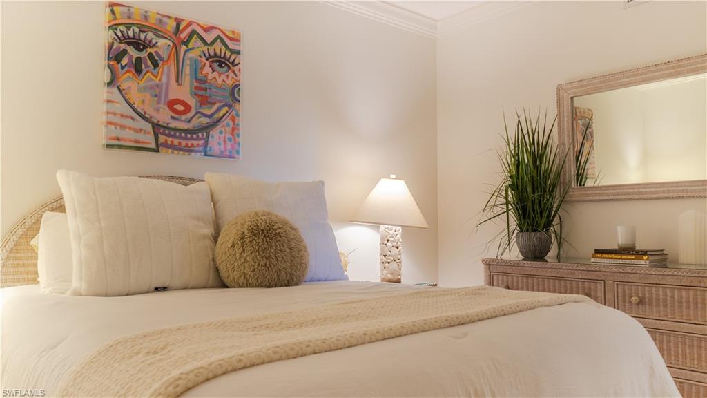 Bedroom featuring crown molding