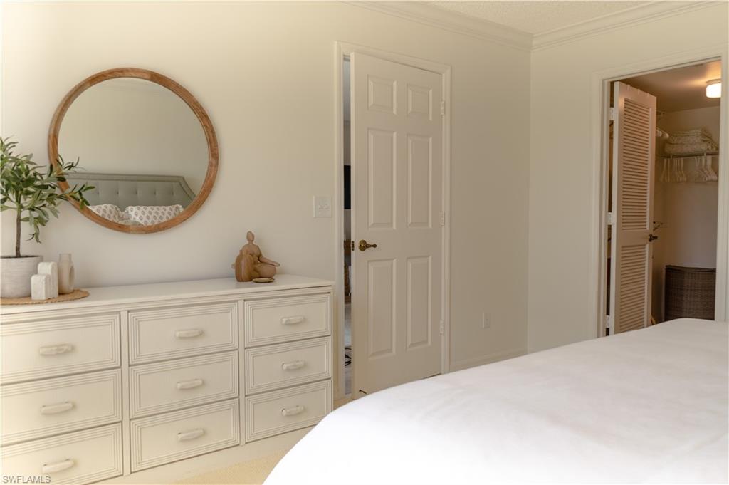 Bedroom featuring crown molding