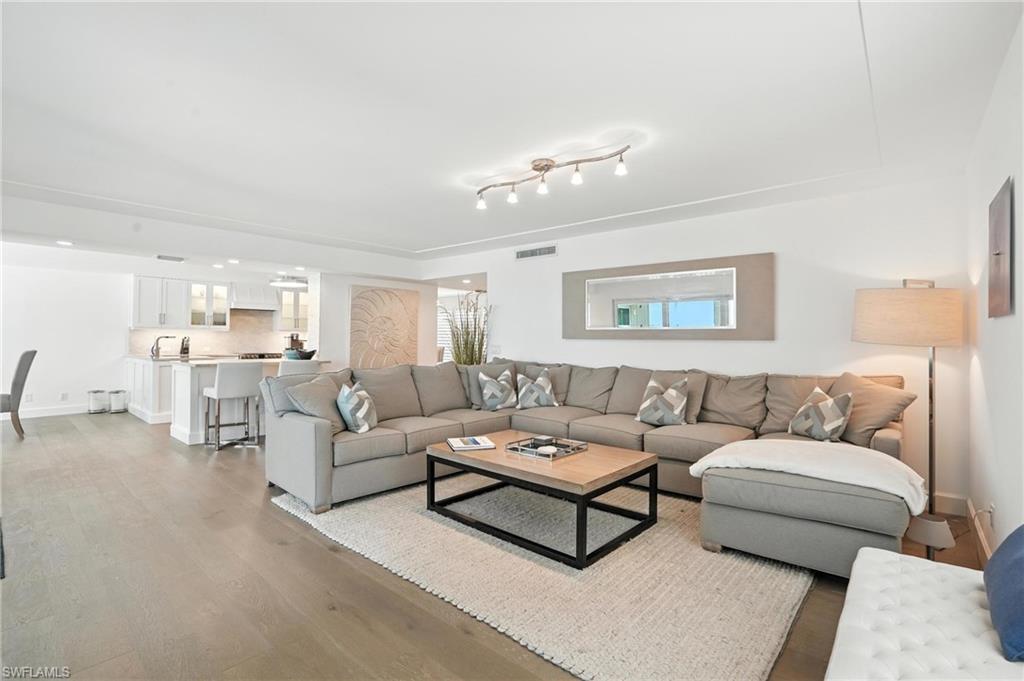 Living area featuring light wood-type flooring and baseboards