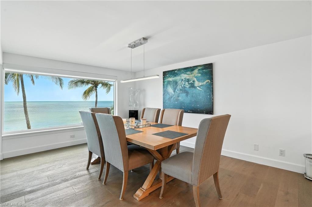 Dining area with wood finished floors and baseboards