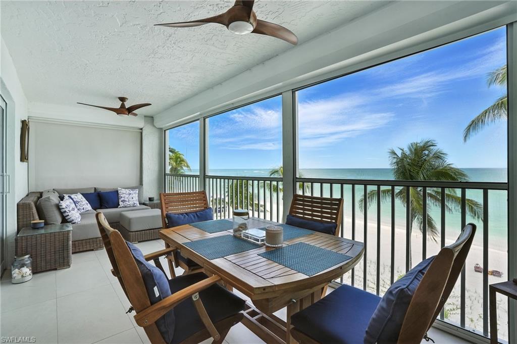 Sunroom / solarium with a water view