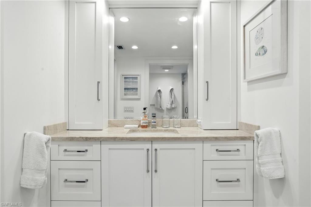 Bathroom featuring vanity and recessed lighting