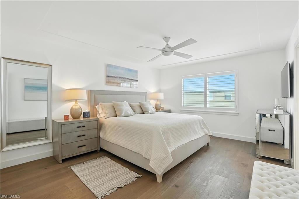 Bedroom featuring wood finished floors and a ceiling fan