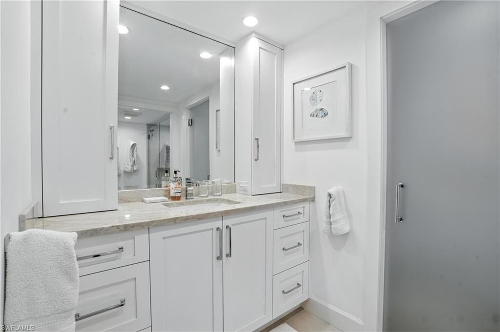 Full bathroom featuring vanity and recessed lighting