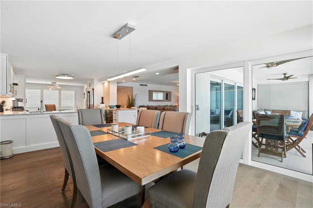 Dining space with light wood-style floors and ceiling fan