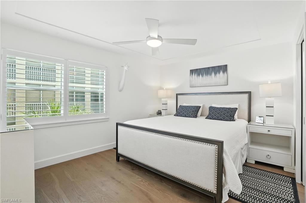 Bedroom featuring wood finished floors and ceiling fan