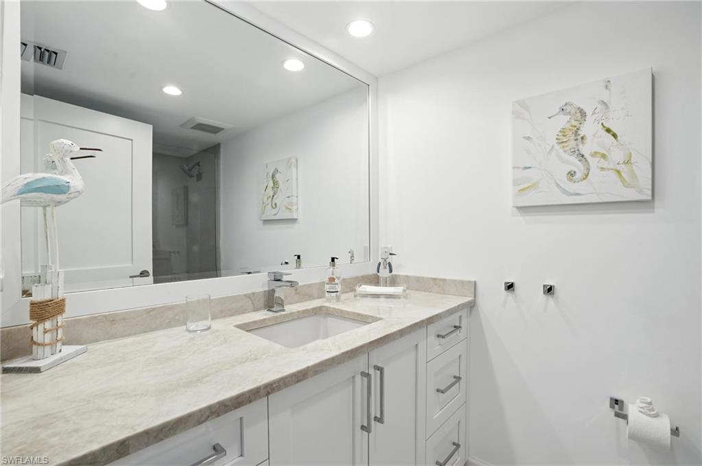 Bathroom featuring vanity and recessed lighting