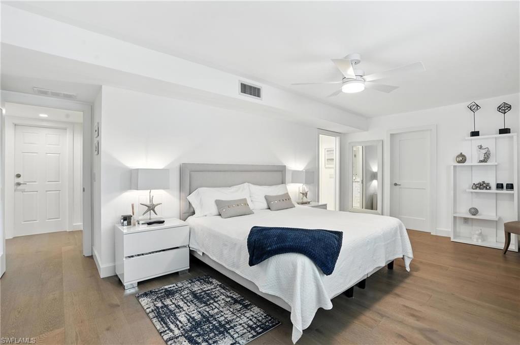 Bedroom with wood finished floors and a ceiling fan