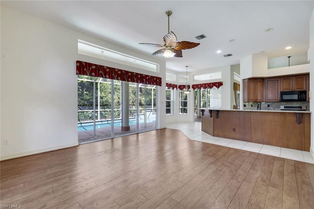 Living room and kitchen are open to one another.
