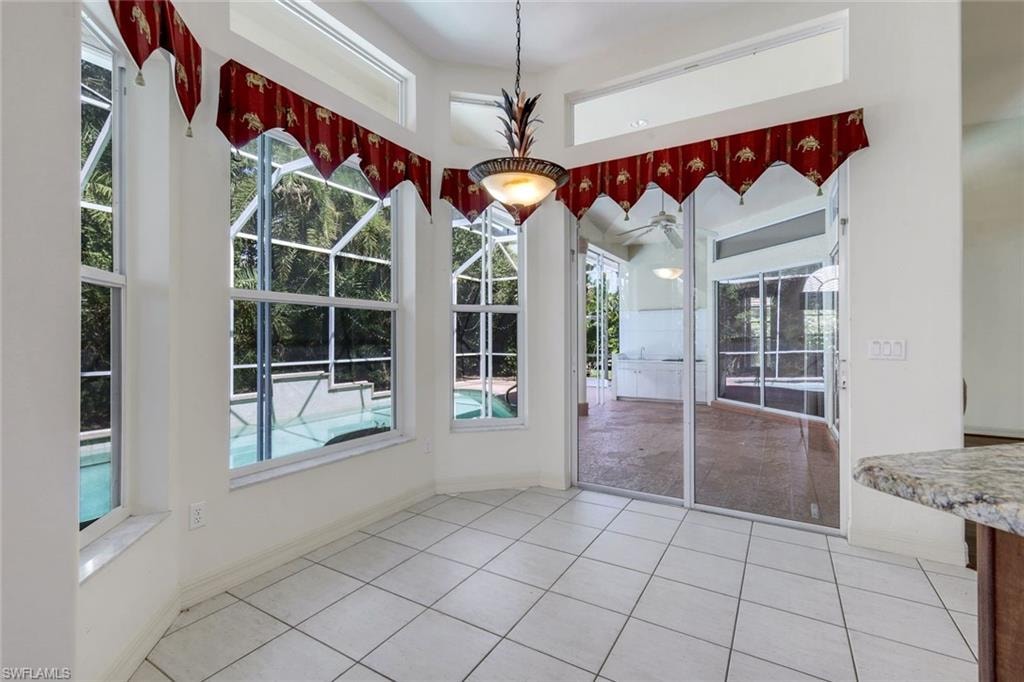Breakfast nook is just off the kitchen featuring pool views.