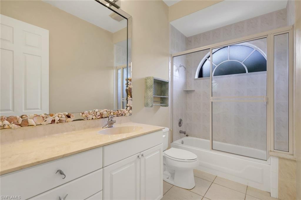 Guest bathroom features a shower/tub combo.