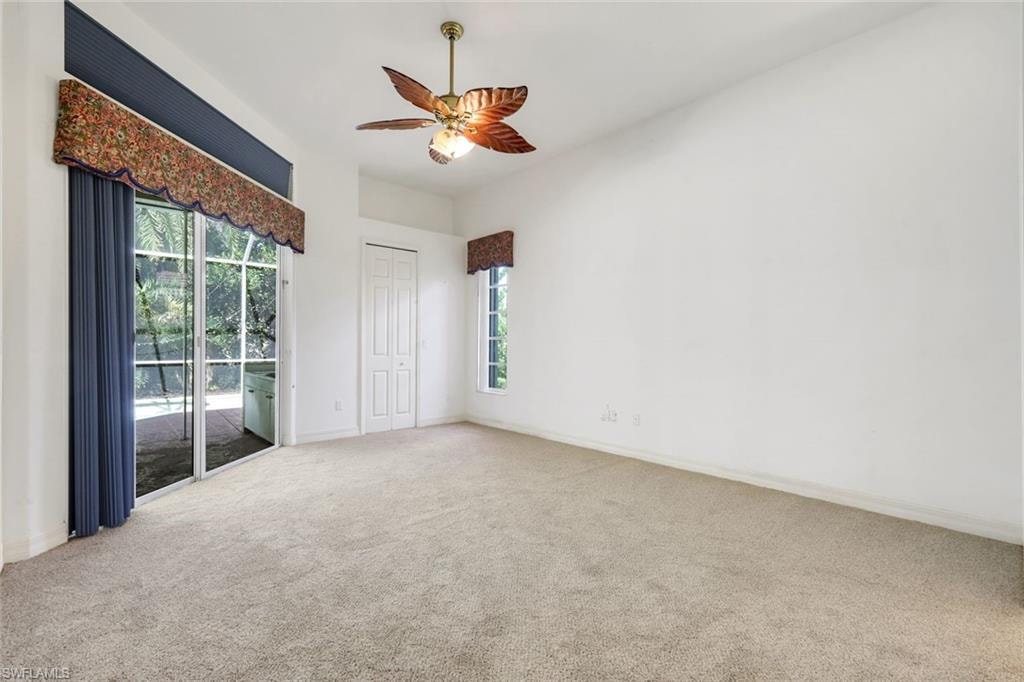 Spacious primary suite offers lanai access.
