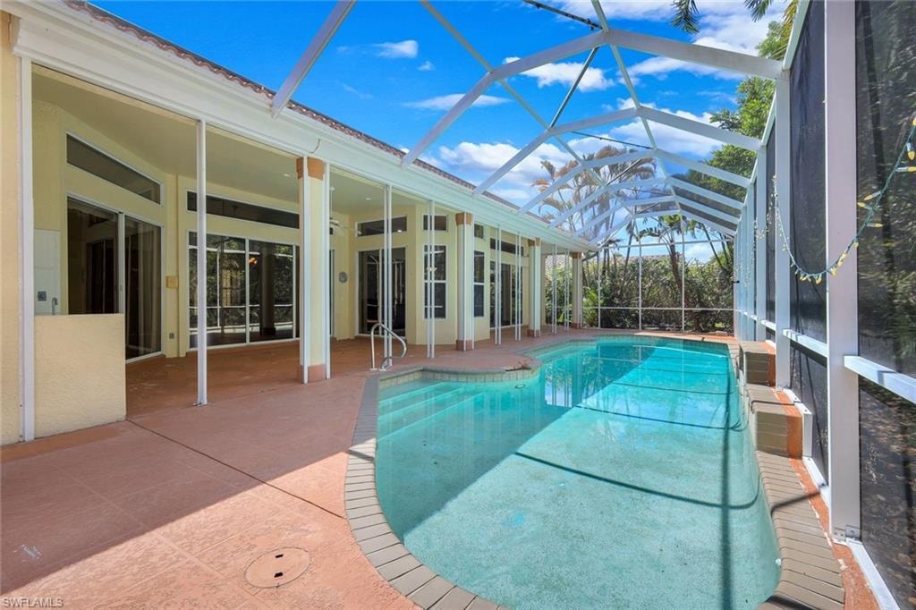 Home features electric hurricane shutters on lanai.