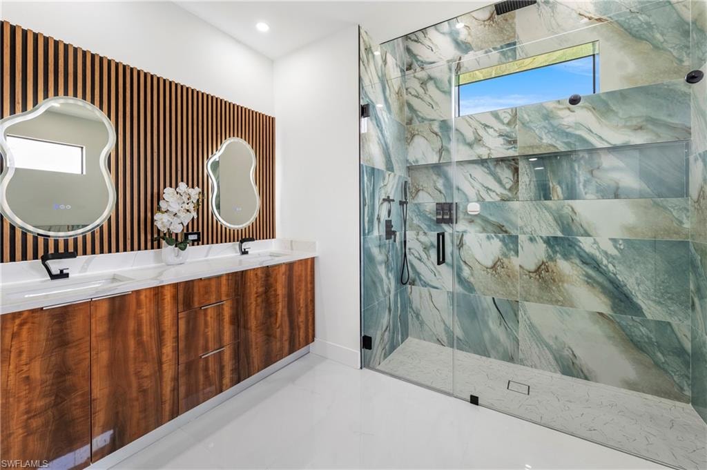 Contemporary bathroom featuring a double vanity with wood-finish cabinetry and white countertops