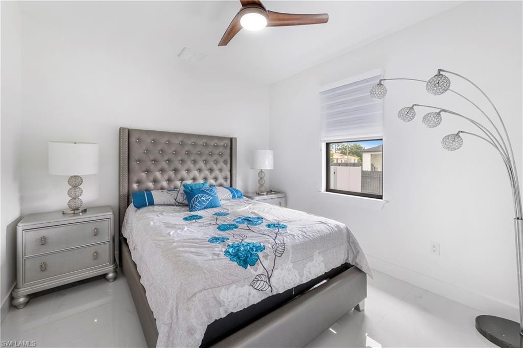 Bright interior room featuring a wood-finish ceiling fan, recessed lighting, and a window with horizontal blinds