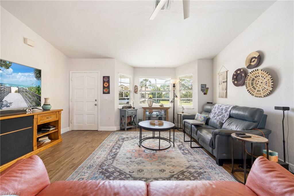 Living room with bay window overlooking front yard