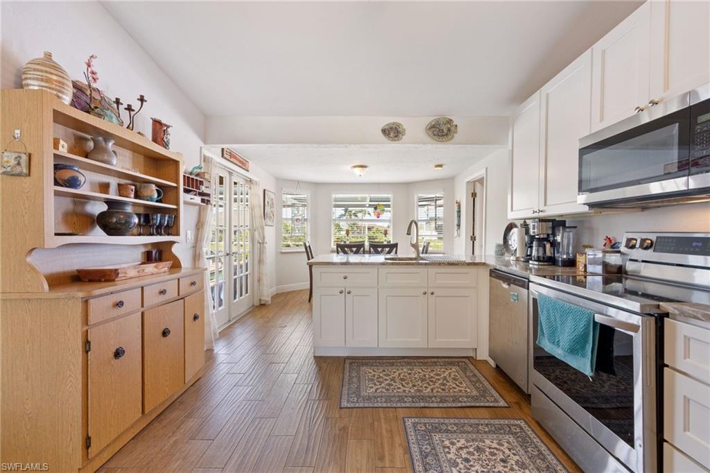 Stainless Steel Appliances Kitchen sink overlooking back