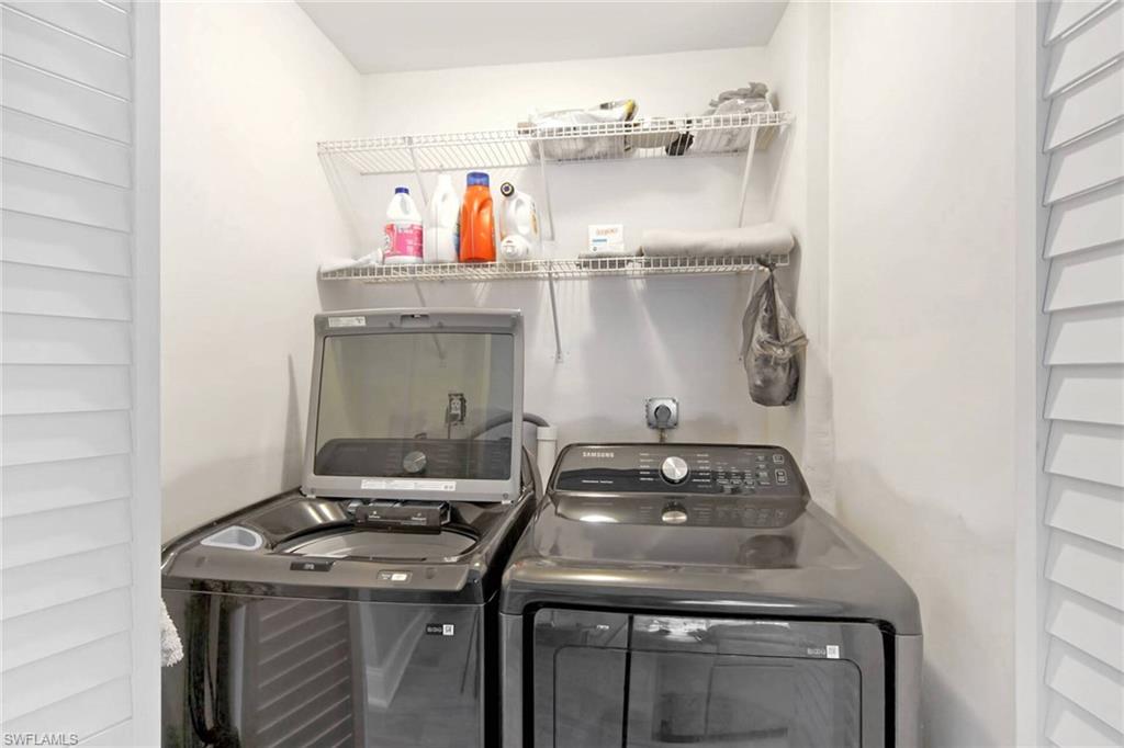 Washroom featuring washer and dryer