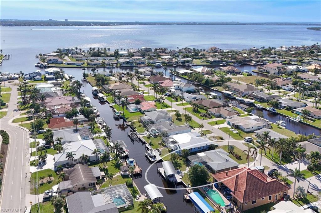 View of property location featuring nearby suburban area and a large body of water