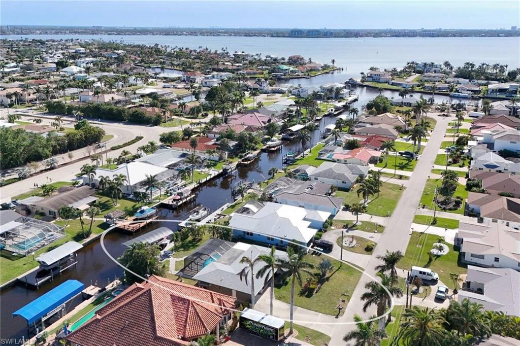 Aerial perspective of suburban area with a large body of water