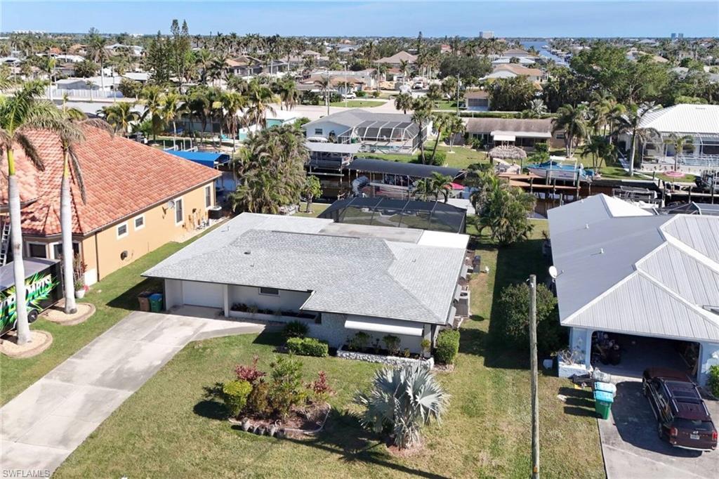 Aerial perspective of suburban area with a large body of water