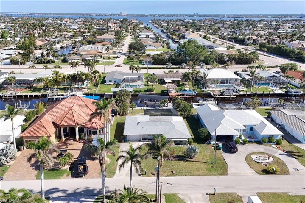 Aerial view of residential area with a nearby body of water
