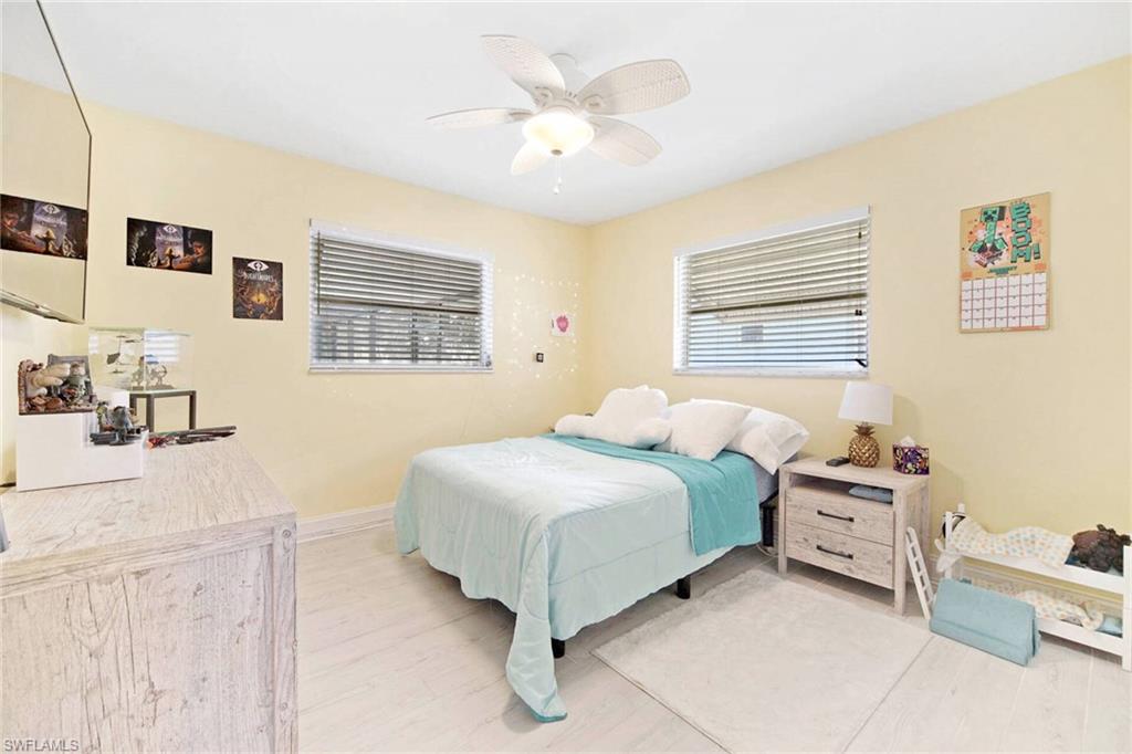 Bedroom featuring a ceiling fan and light wood-type flooring