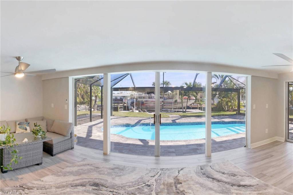 Swimming pool featuring a patio area, outdoor lounge area, and a lanai