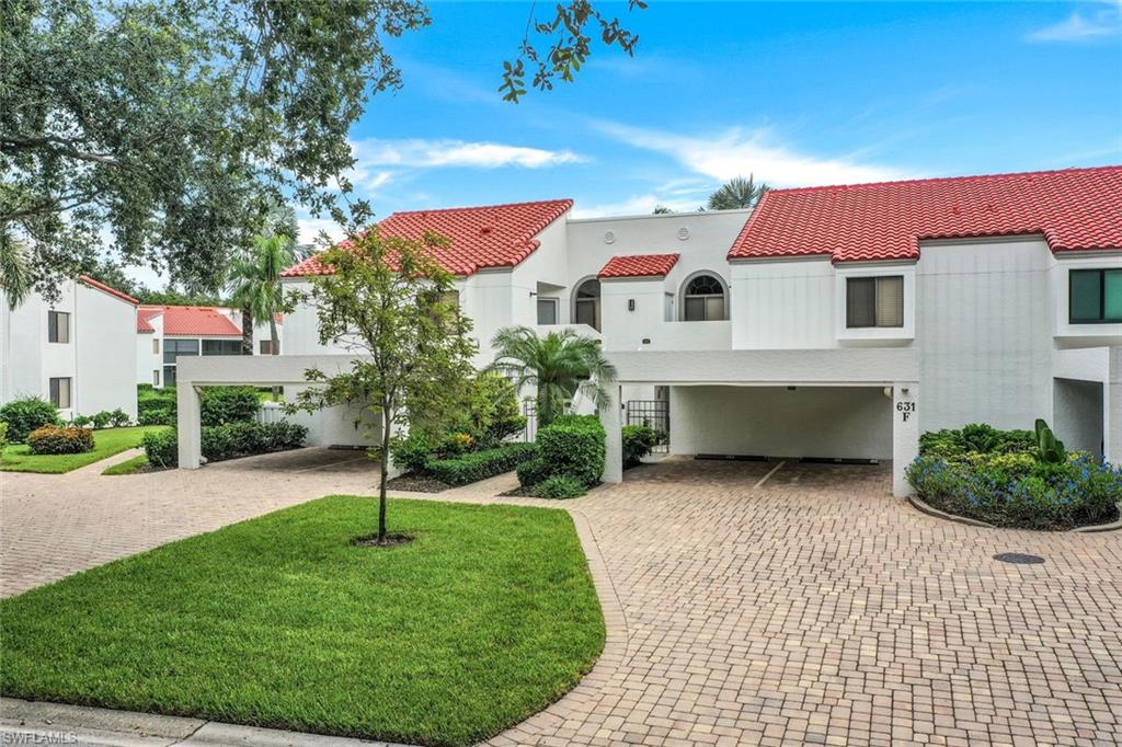 Mediterranean / spanish home featuring a front lawn