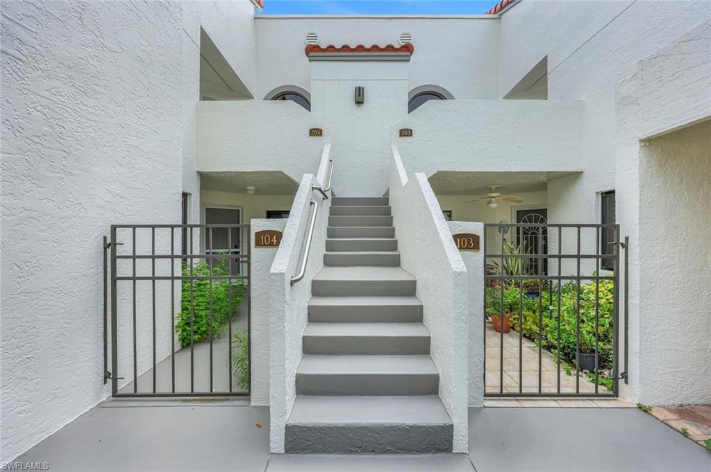 Doorway to property with ceiling fan
