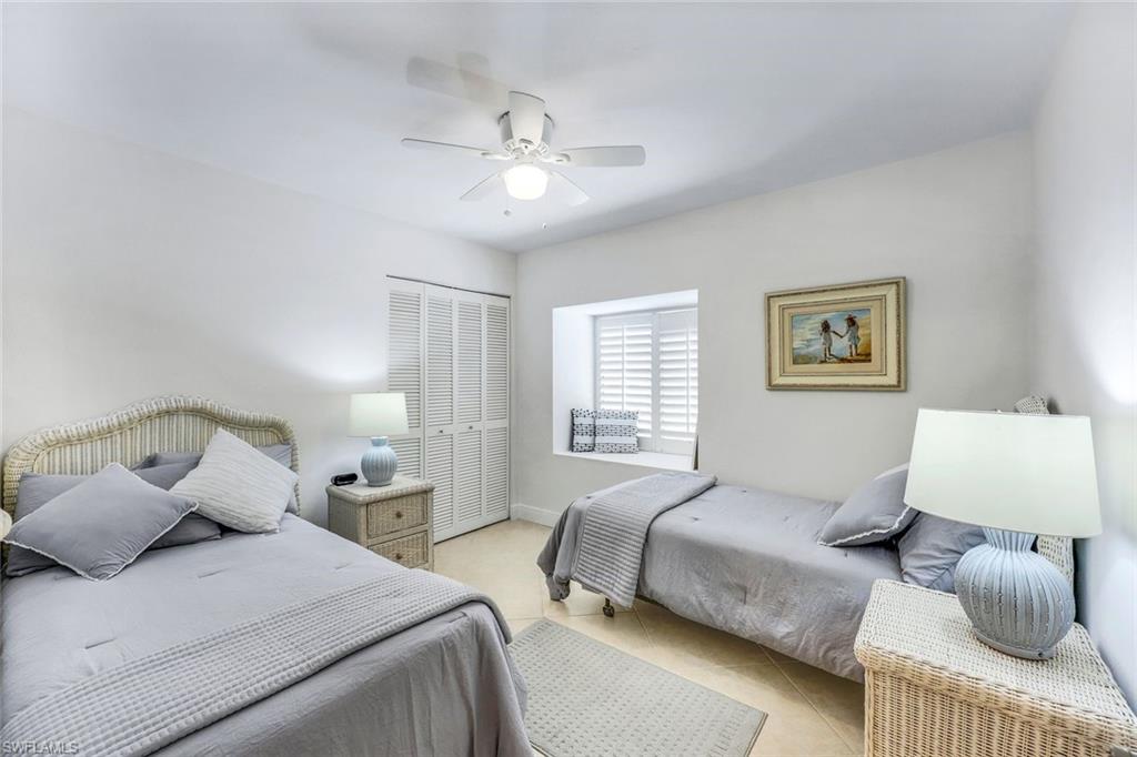 Bedroom featuring ceiling fan and a closet