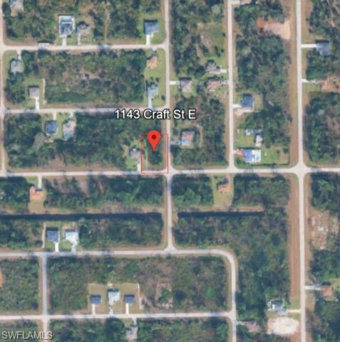 Aerial view of property's location with property parcel outlined