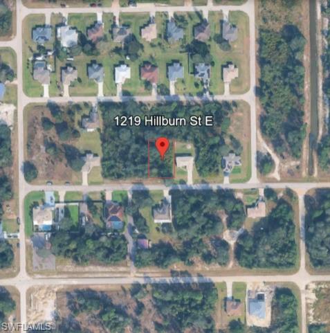 Aerial overview of property's location with property parcel outlined