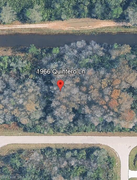 Aerial overview of property's location featuring a nearby body of water